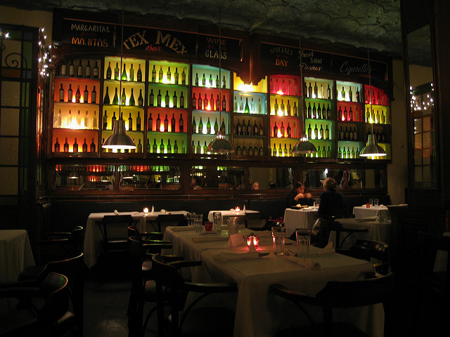 Colorfully Lit Bar With Beer Bottles